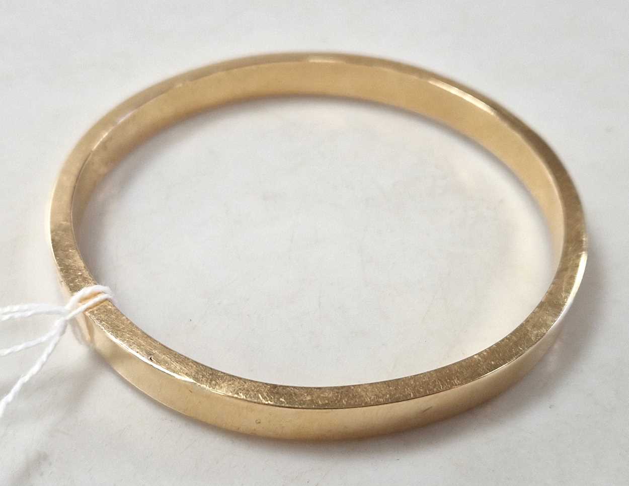 Lot 324 - A hallmarked 15ct gold arm bangle, weight 18.5g