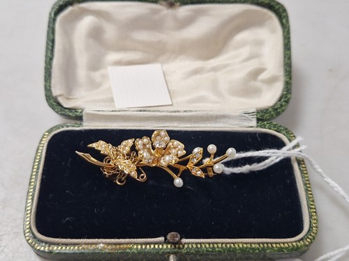 Lot 197 - A diamond and split pearl flower brooch,...