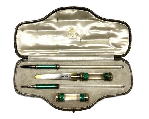 Lot 518 - A George V silver, enamel and rock crystal writing set, mark of Asprey & Company