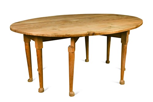 Lot 673 - A pine oval drop flap table, early 20th century