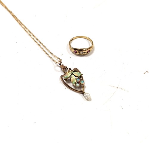 Lot 207 - An opal, pearl and enamel pendant tested as...