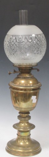 Lot 70 - Victorian brass oil lamp with etched glass...