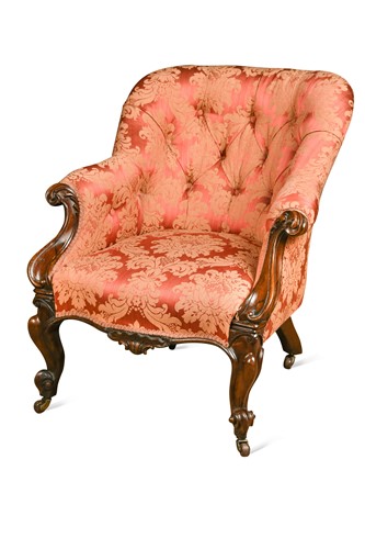 Lot 602 - A mid Victorian carved rosewood and button backed armchair