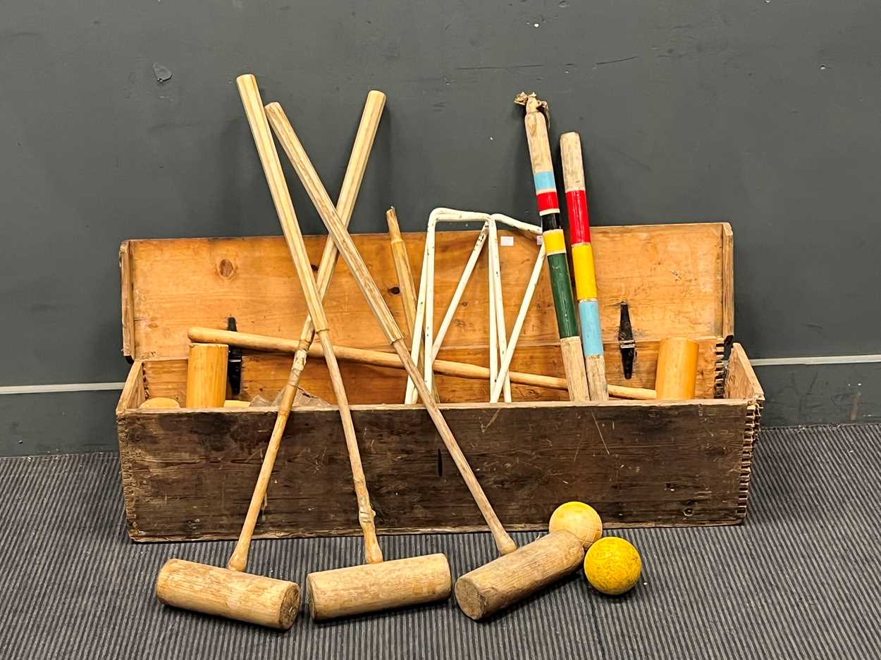 Lot 582 - A 20th century croquet set in a pine box,...