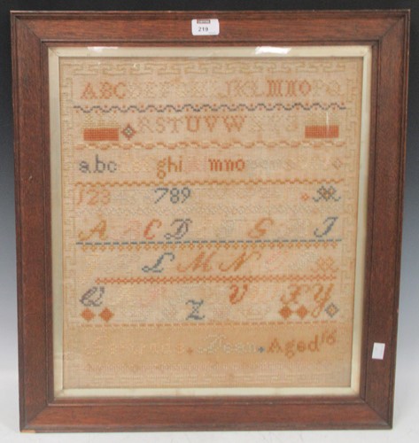 Lot 219 - A Victorian oak framed needlework sampler (a...