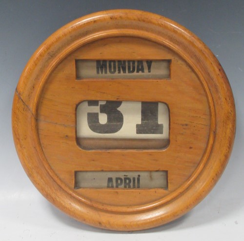 Lot 87 - A Victorian day date calendar. 31.5 diam