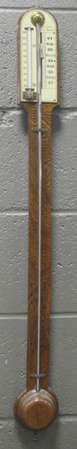 Lot 185 - An early 20th centruy oak cased stick...