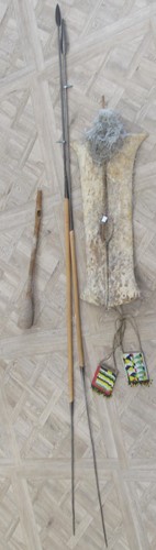 Lot 118 - Two spears and a leather shield with feather,...