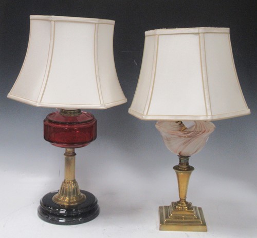 Lot 83 - Two brass lamps one with ruby glass resovoir,...