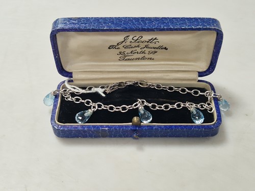 Lot 355 - A hallmarked 9ct gold bracelet with topaz...