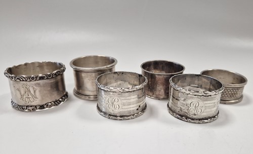 Lot 374 - A collection of six silver napkin rings 156.2g...