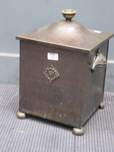 Lot 153 - An early 20th century hammered lidded metal...