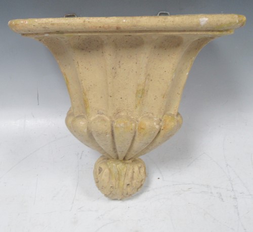 Lot 37 - A painted plaster wall bracket in the...