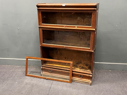 Lot 556 - An oak Globe Wernicke sectional bookcase or...