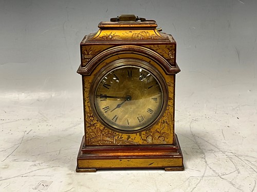 Lot 57 - An Edwardian mantel clock, with red and gilt...