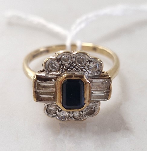 Lot 328 - A sapphire and diamond cluster ring,...