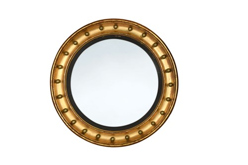 Lot 584 - A Regency giltwood convex mirror