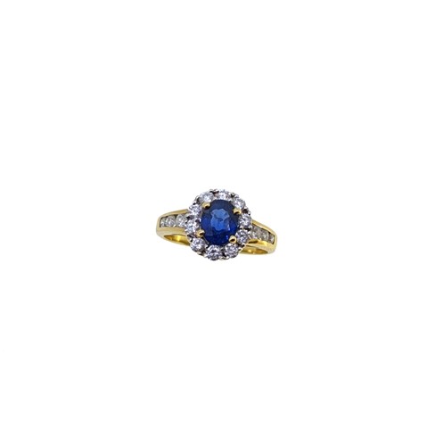 Lot 246 - A sapphire and diamond cluster ring