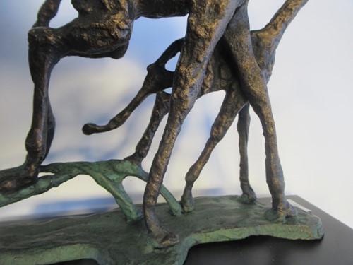 Lot 13 - A bronzed metal model of two galloping...