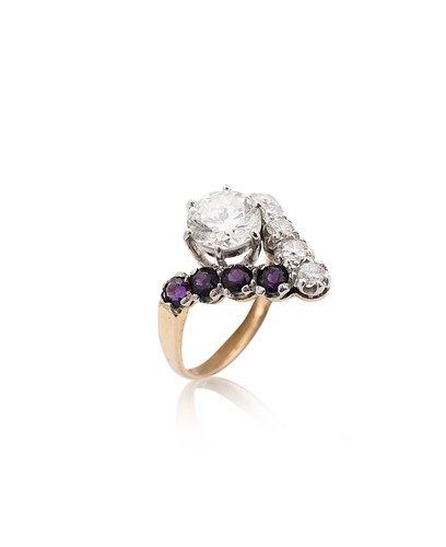 Lot 94 - A 9ct gold diamond and amethyst ring