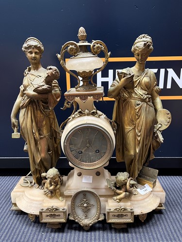 Lot 147 - A gilt metal and marble figural mantle clock...