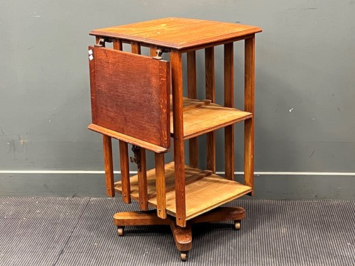 Lot 540 - An early 20th century oak revolving bookcase,...