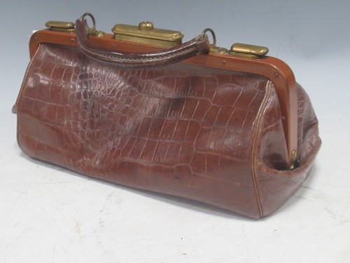 Lot 82 - A small hand valise, or hand bag in crocodile...