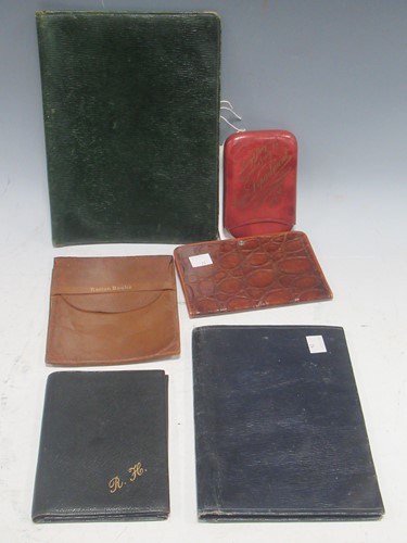 Lot 54 - A group of small leather items to include a...