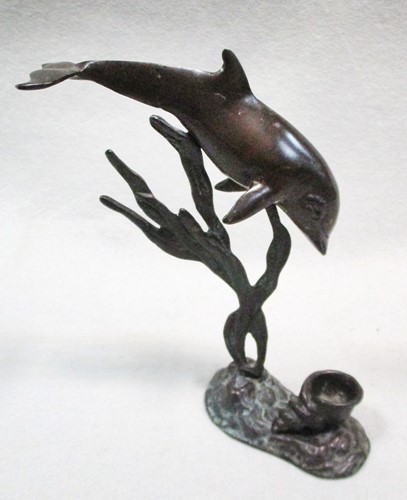 Lot 113 - A bronze candle holder cast as a dolphin