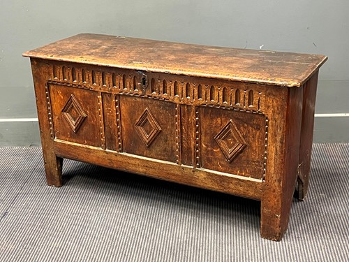 Lot 429 - An early 18th century oak coffer, with three...