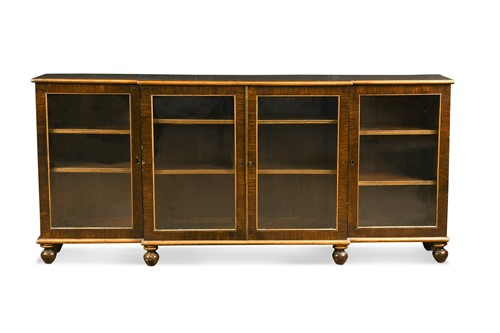 Lot 734 - A faux rosewood and gilt painted breakfront bookcase, 20th century