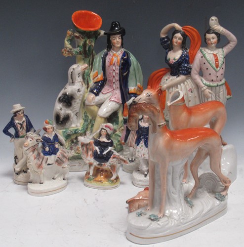 Lot 131 - A collection of Staffordshire figures...