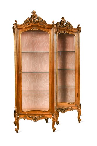 Lot 677 - A pair of French Louis XV style carved walnut vitrines, late 19th century