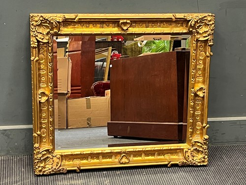 Lot 434 - A rectangular gilt framed wall mirror, the...