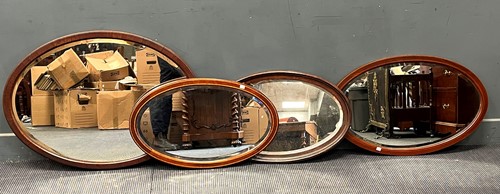 Lot 373 - Four oval wall mirrors, to include two...