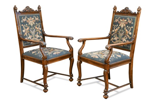 Lot 497 - A pair of Continental walnut framed elbow chairs, early 20th century