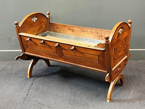 Lot 523 - A 19th century Continental walnut and inlaid cradle
