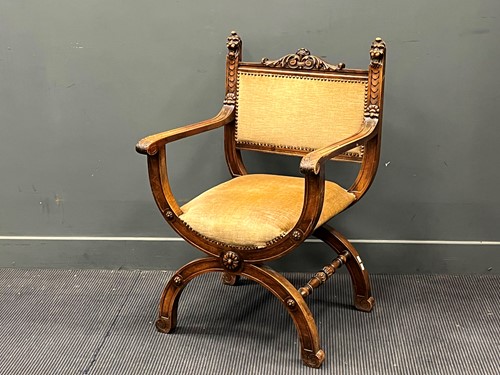 Lot 400 - A Continental walnut Savonarola chair in the...