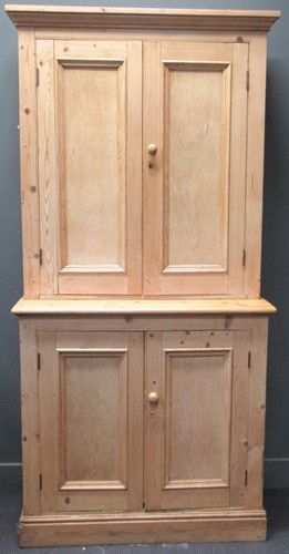 Lot 483 - A large pine cupboard with plinth base 215 x...