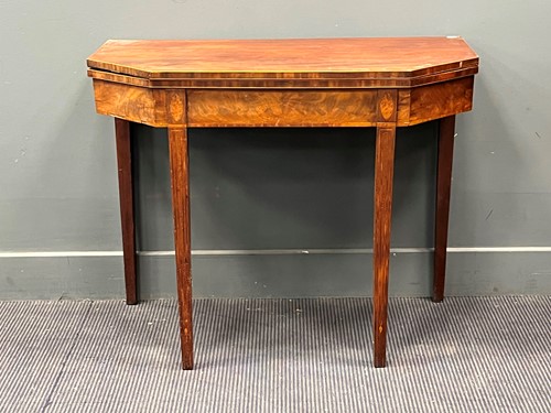 Lot 412 - A George III line inlaid mahogany card table...