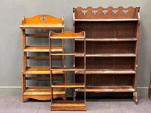 Lot 536 - An oak Arts and Crafts book shelf with four...