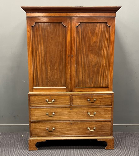 Lot 495 - A late Georgian mahogany linen press with...