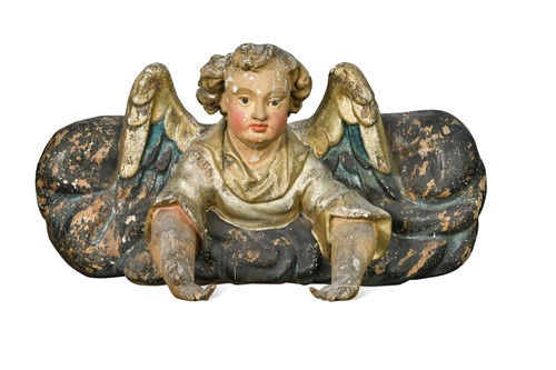 Lot 15 - A carved wood and gesso painted model of a putto in a cloud, 17th-century