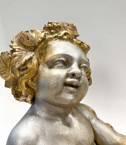 Lot 1 - A carved and gilded figure of a Bacchic putto, 19th or 20th century