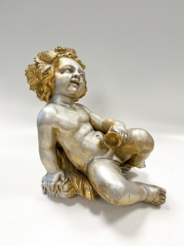 Lot 1 - A carved and gilded figure of a Bacchic putto, 19th or 20th century