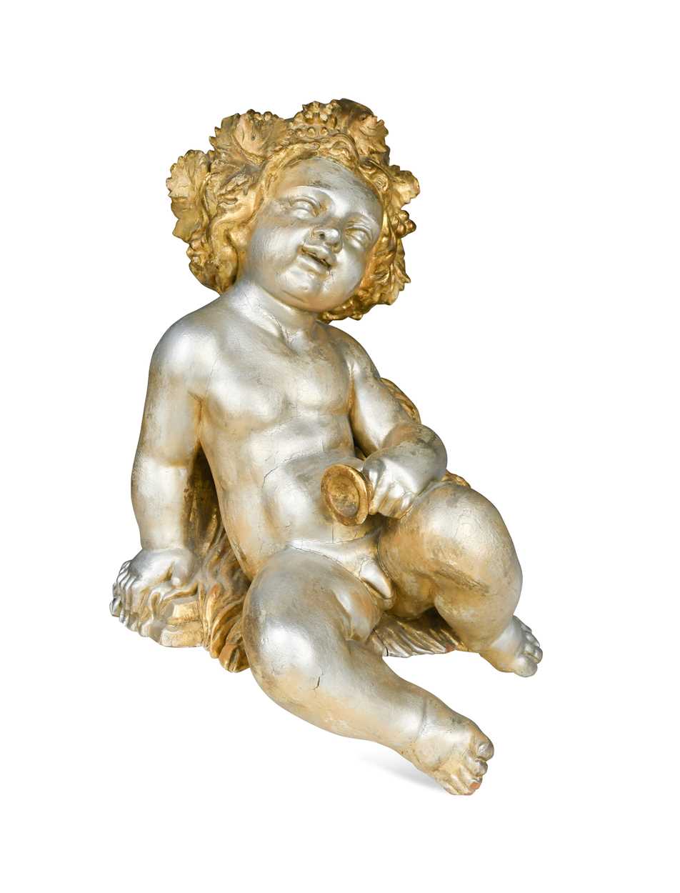 Lot 1 - A carved and gilded figure of a Bacchic putto, 19th or 20th century