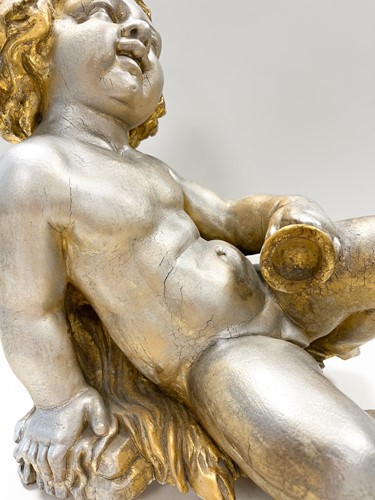 Lot 1 - A carved and gilded figure of a Bacchic putto, 19th or 20th century