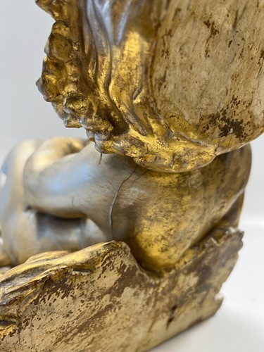 Lot 1 - A carved and gilded figure of a Bacchic putto, 19th or 20th century