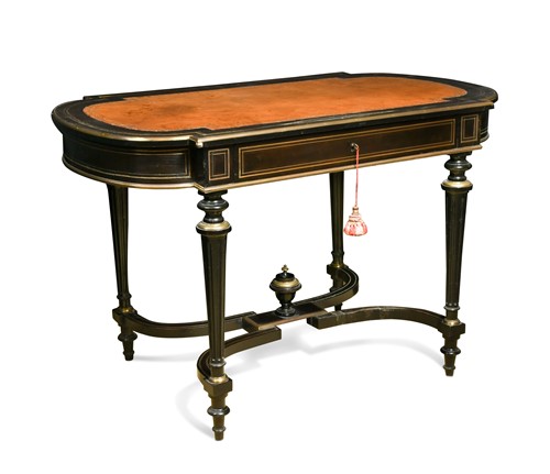 Lot 162 - A Louis XVI style leather-inset ebonised writing table