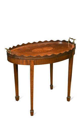 Lot 153 - An Edwardian oval mahogany tray-top table